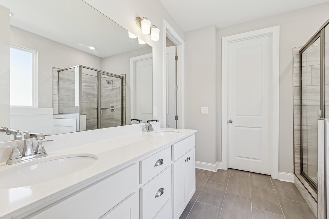 7205 Lake Road Northwest Fairview, TN 37062 - Photo 14 of 28 a bathroom with a sink double vanity and a mirror