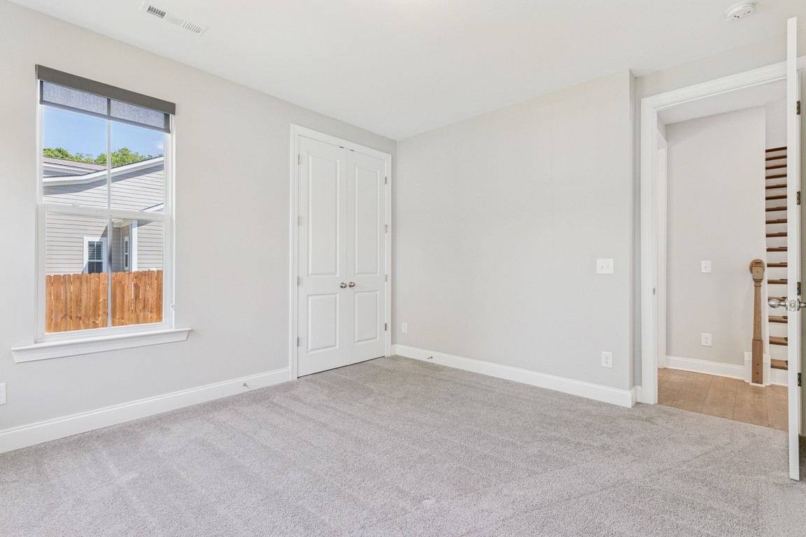 7205 Lake Road Northwest Fairview, TN 37062 - Photo 18 of 28 an empty room with windows and closet