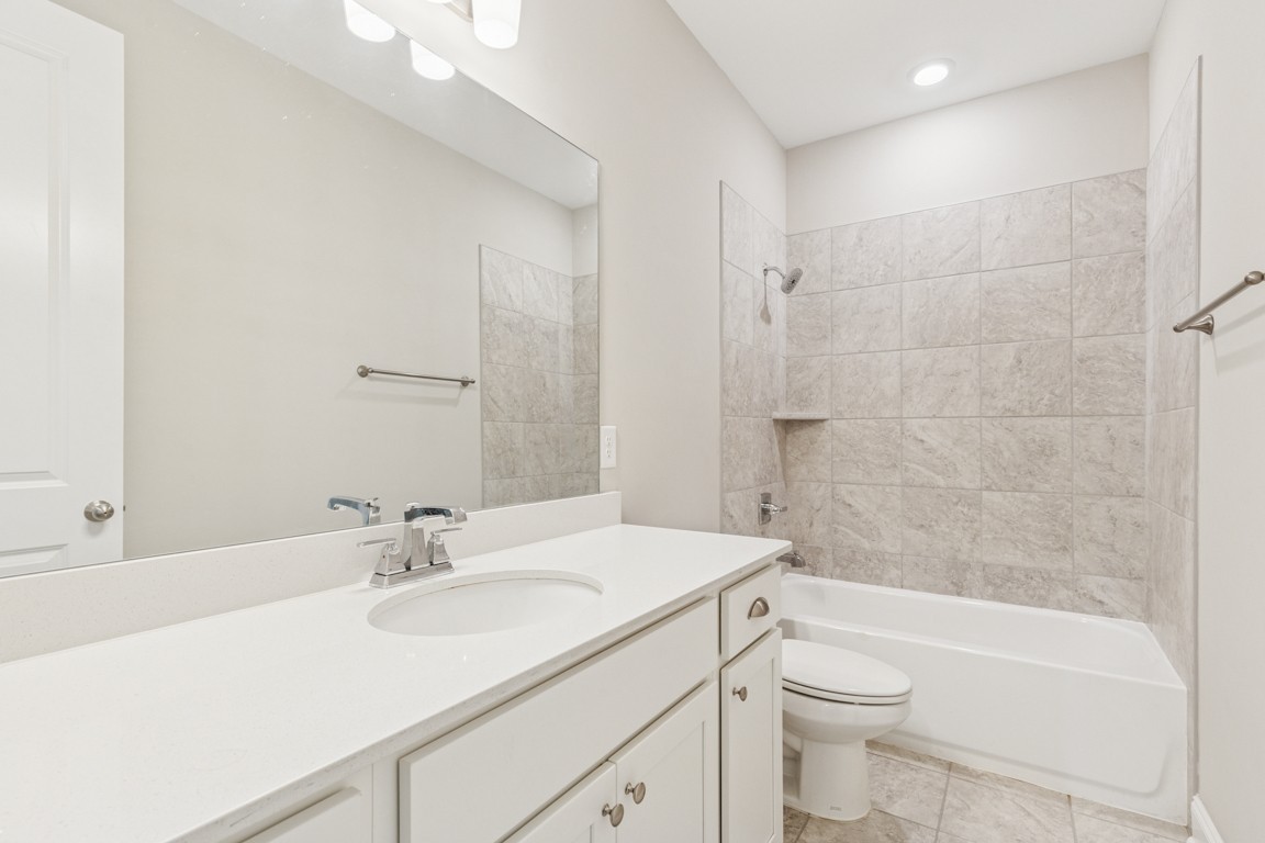 7205 Lake Road Northwest Fairview, TN 37062 - Photo 19 of 28 a bathroom with a sink a toilet and shower