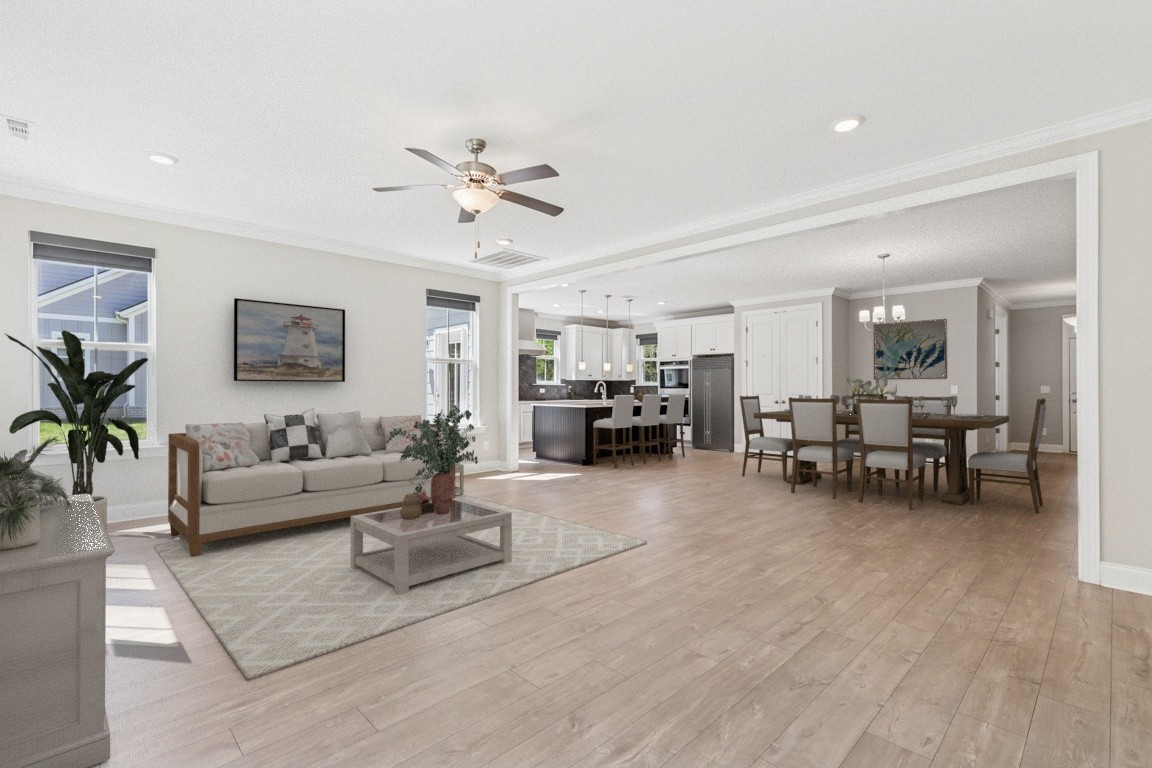 7205 Lake Road Northwest Fairview, TN 37062 - Photo 2 of 28 a living room with furniture and a dining table with wooden floor