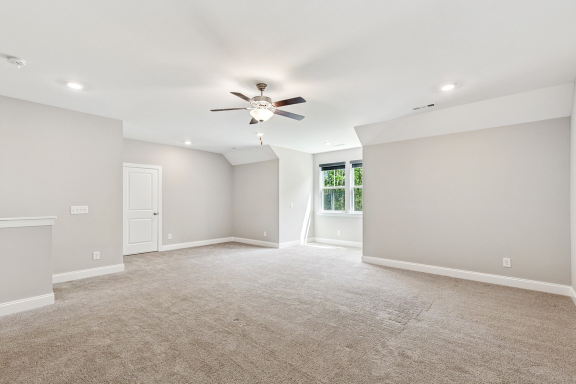 7205 Lake Road Northwest Fairview, TN 37062 - Photo 22 of 28 an empty room with a ceiling fan and a window