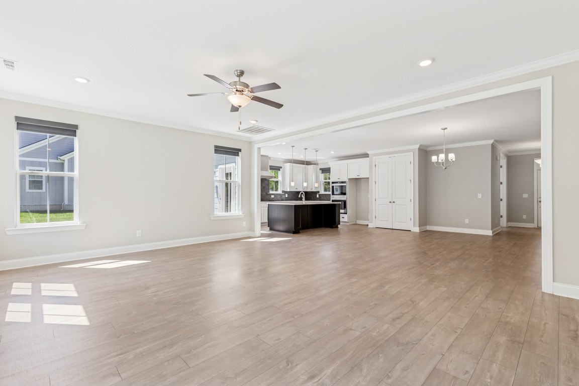 7205 Lake Road Northwest Fairview, TN 37062 - Photo 8 of 28 a view of a livingroom with a kitchen and a stove top oven