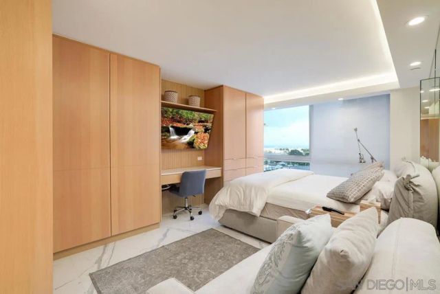 a bed room with a bed and a window