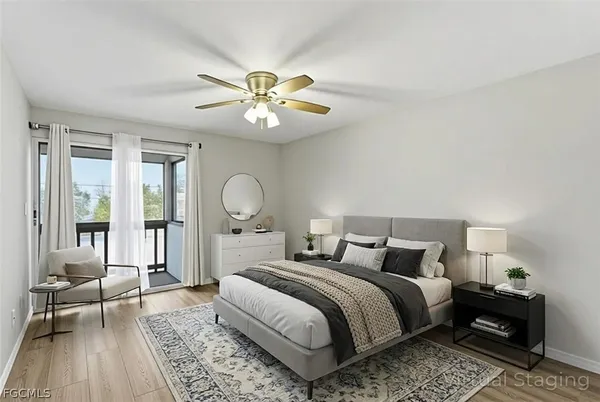 a bedroom with double bed and a large window