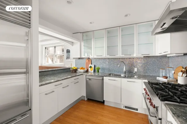 a living room with furniture window and wooden floor