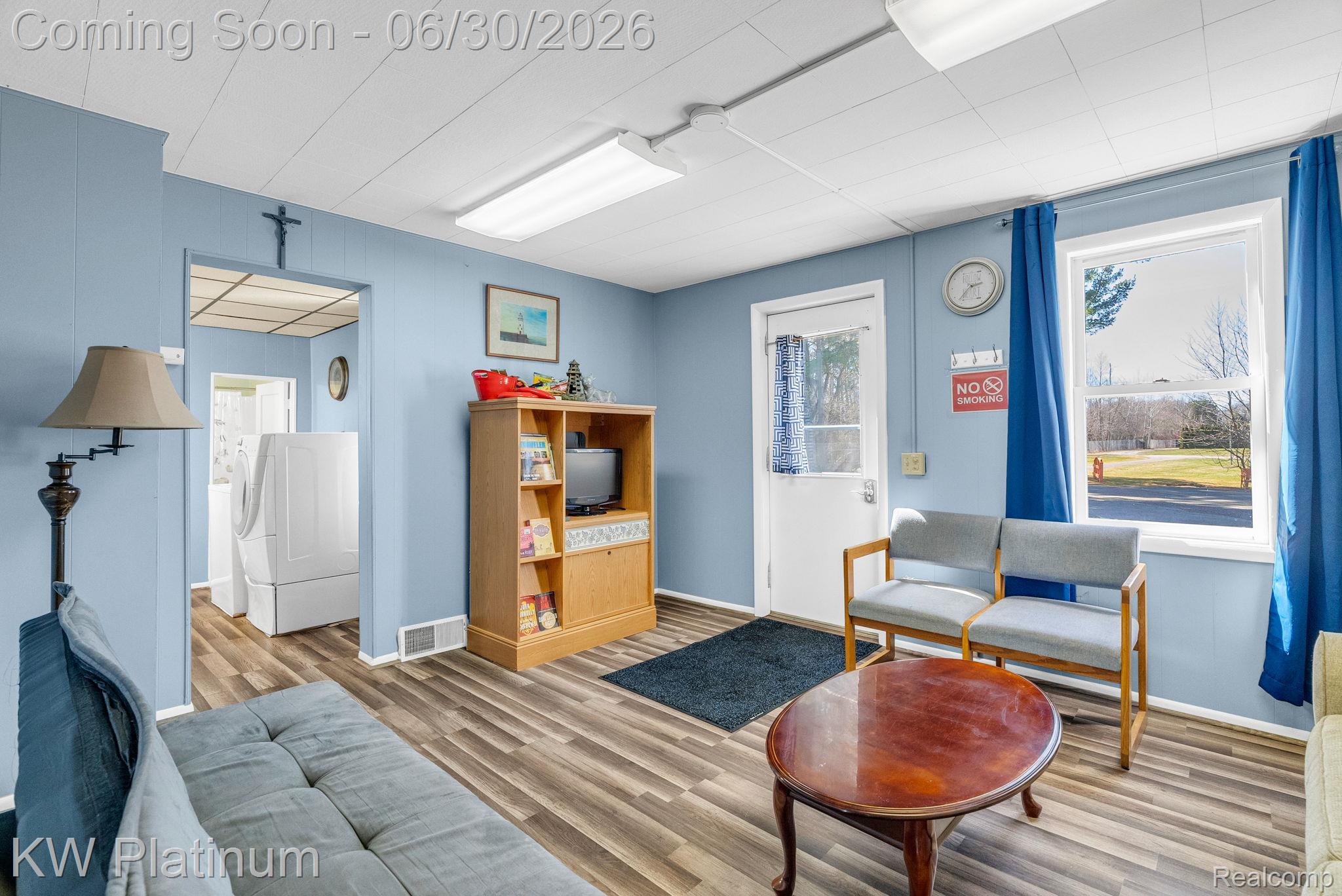 2235 South Lake Shore Road Harbor Beach, MI 48441 - Photo 69 of 99 Interior space featuring wood-finish flooring, light blue paneled walls, and white ceiling panels