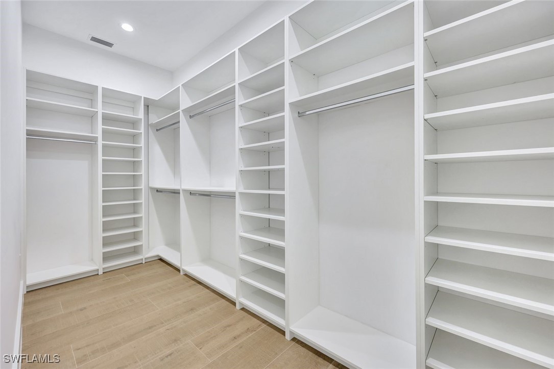 1 Southwest 33rd Place Cape Coral, FL 33991 - Photo 19 of 38 a view of an empty walk in closet