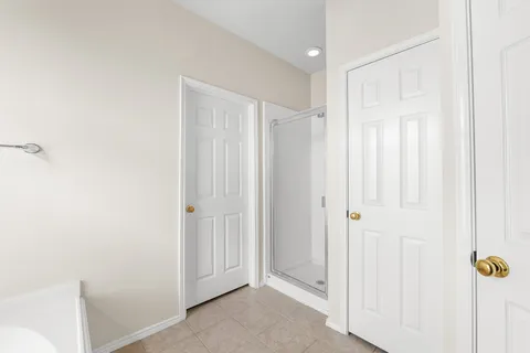 a bathroom with a bathtub a sink and a window