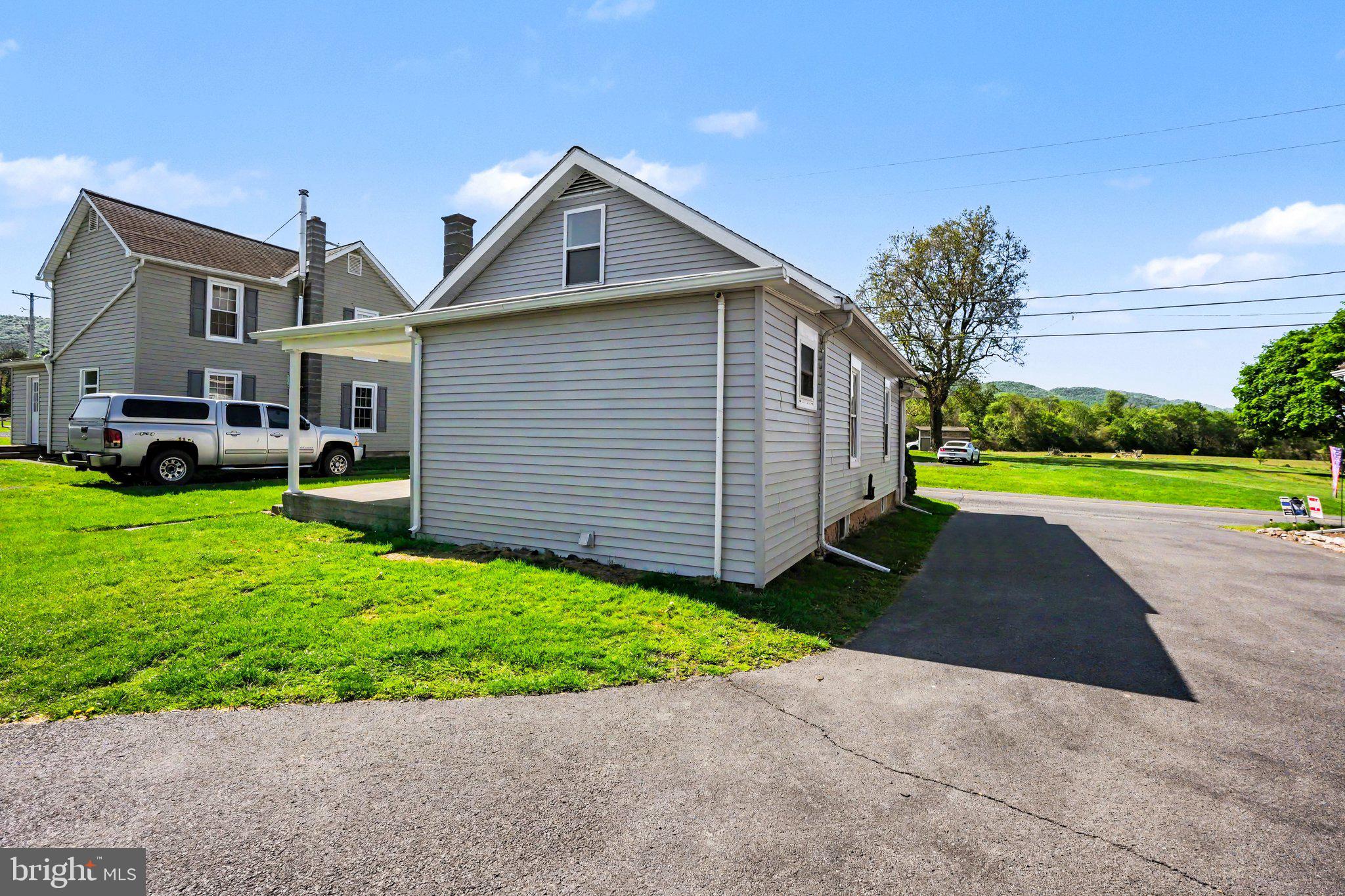 1441 North River Road Granville, PA 17029 - Photo 24 of 28 a front view of a house with a yard and garage