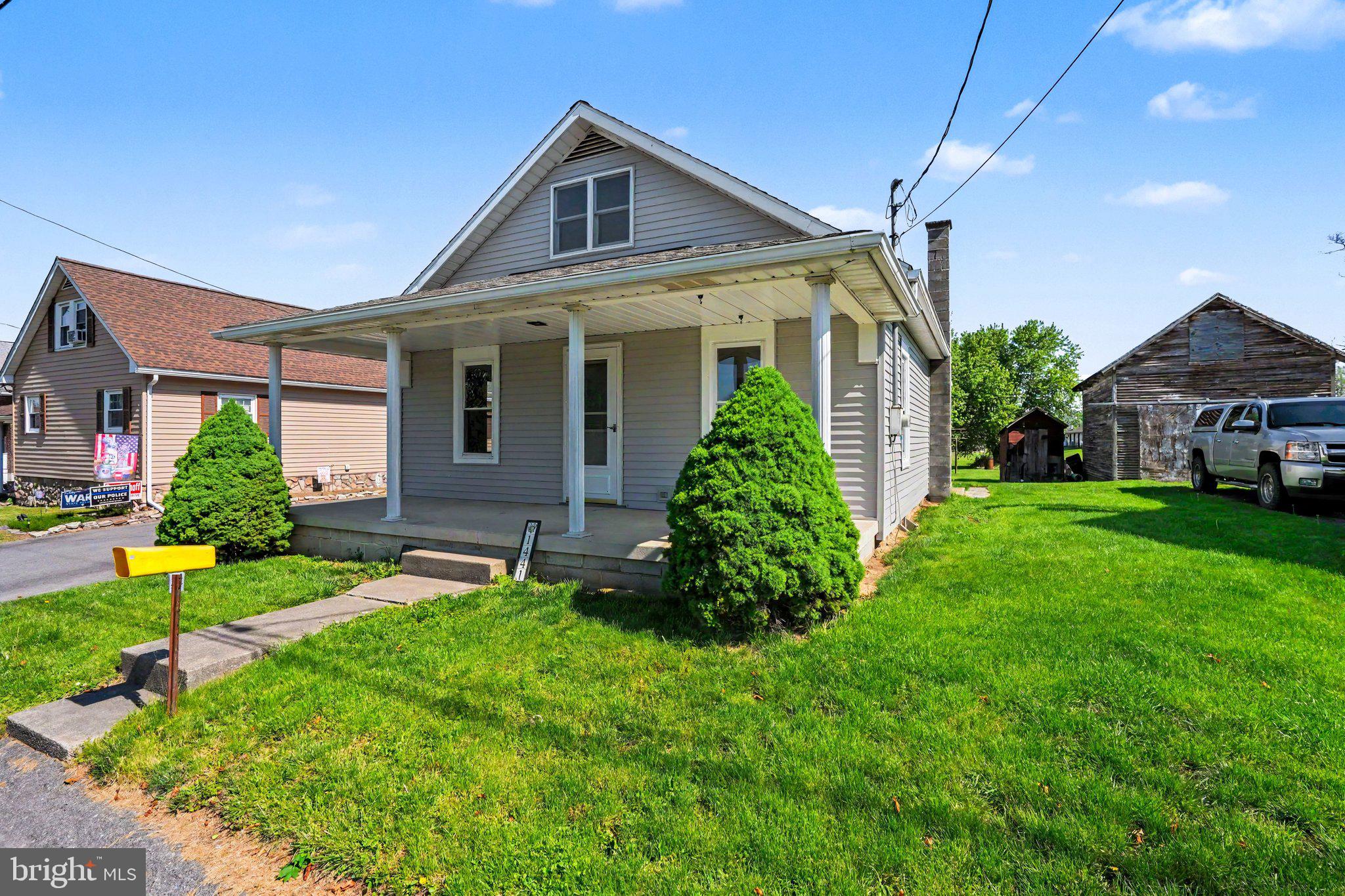 1441 North River Road Granville, PA 17029 - Photo 25 of 28 a front view of a house with a yard