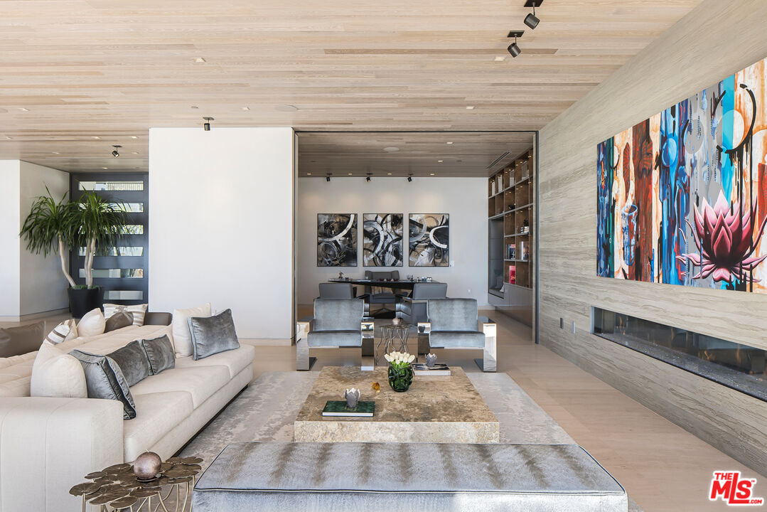 5046 Carbon Beach Terrace Malibu, CA 90265 - Photo 13 of 75 a living room with furniture and a painting on the wall
