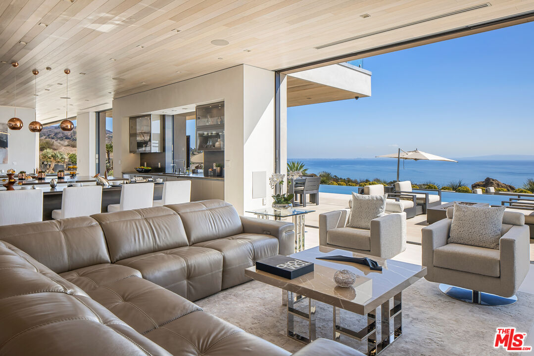 5046 Carbon Beach Terrace Malibu, CA 90265 - Photo 24 of 75 a living room with furniture and a large window