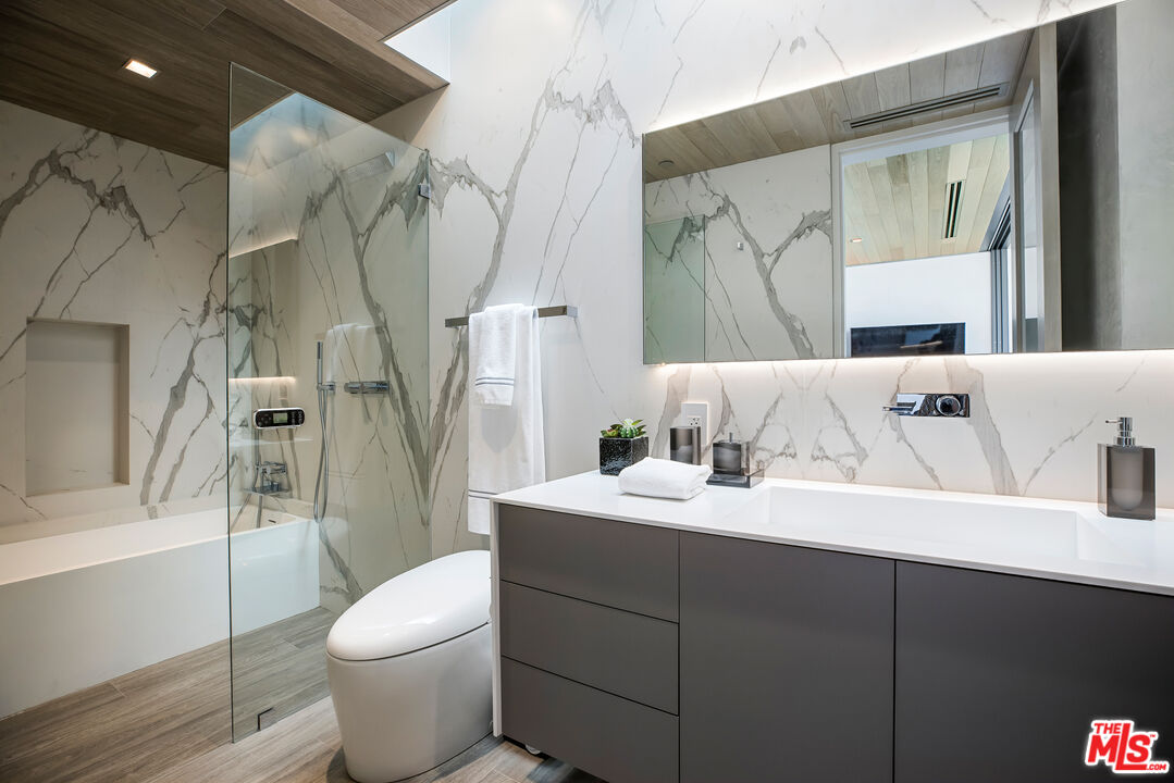 5046 Carbon Beach Terrace Malibu, CA 90265 - Photo 44 of 75 a bathroom with a sink toilet and shower