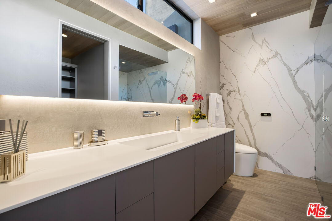 5046 Carbon Beach Terrace Malibu, CA 90265 - Photo 49 of 75 a bathroom with a sink a toilet and shower