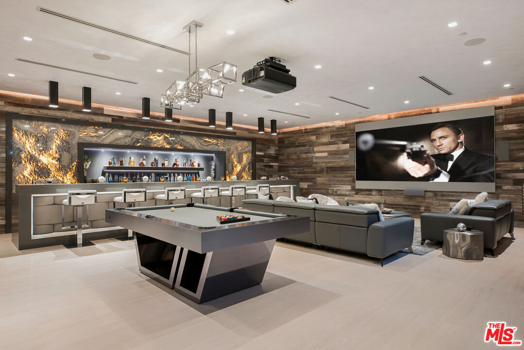 5046 Carbon Beach Terrace Malibu, CA 90265 - Photo 54 of 75 a kitchen with stainless steel appliances granite countertop a stove and a microwave