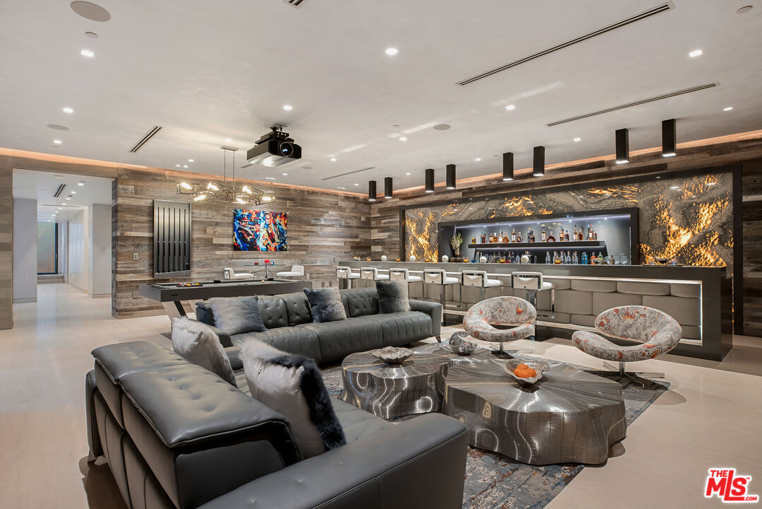 5046 Carbon Beach Terrace Malibu, CA 90265 - Photo 55 of 75 a living room with furniture a ceiling fan and kitchen view