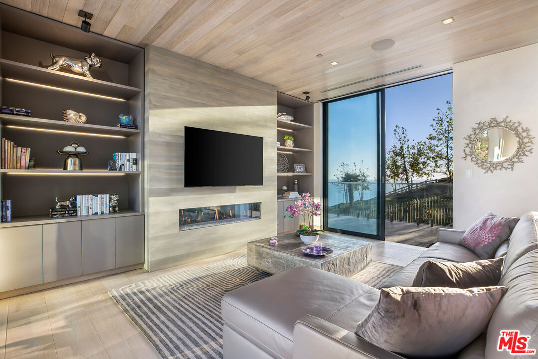 5046 Carbon Beach Terrace Malibu, CA 90265 - Photo 63 of 75 a living room with furniture and a flat screen tv