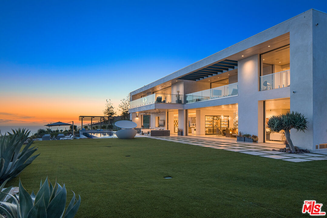 5046 Carbon Beach Terrace Malibu, CA 90265 - Photo 74 of 75 a front view of a building with garden