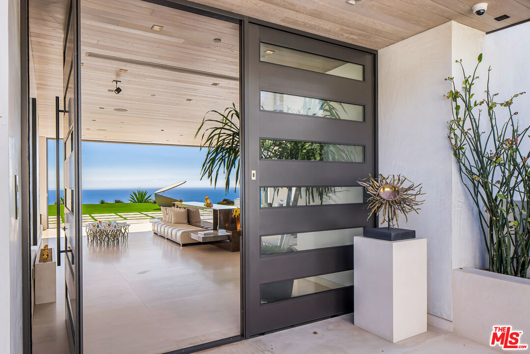 5046 Carbon Beach Terrace Malibu, CA 90265 - Photo 8 of 75 a view of a living room and entryway