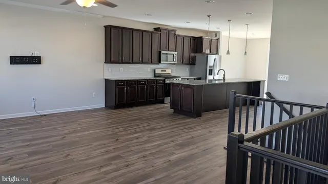 a white toilet sitting next to a bath tub