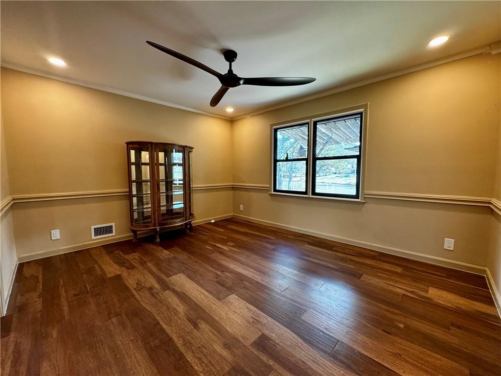 1709 Rangewood Drive Southwest Lilburn, GA 30047 - Photo 14 of 52 an empty room with wooden floor and windows