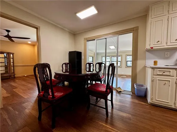 a view of a dining room with furniture window and wooden floor