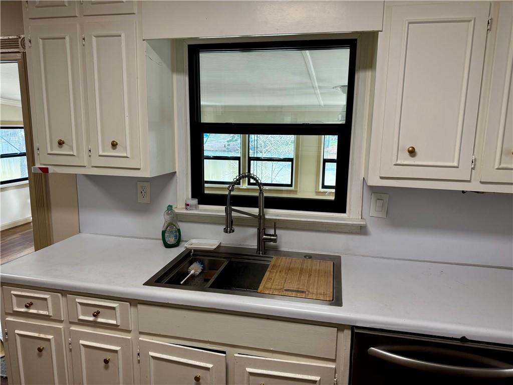 1709 Rangewood Drive Southwest Lilburn, GA 30047 - Photo 19 of 52 a kitchen with a cabinets and a stove