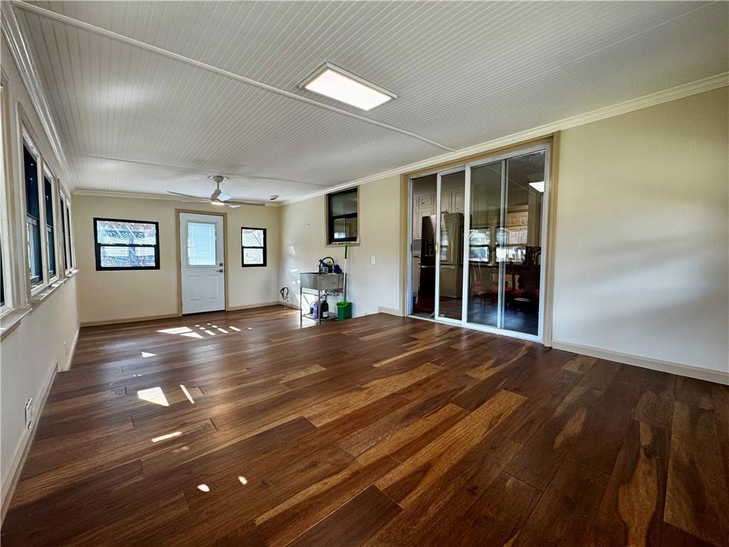 1709 Rangewood Drive Southwest Lilburn, GA 30047 - Photo 23 of 52 a view of an empty room with wooden floor and a window