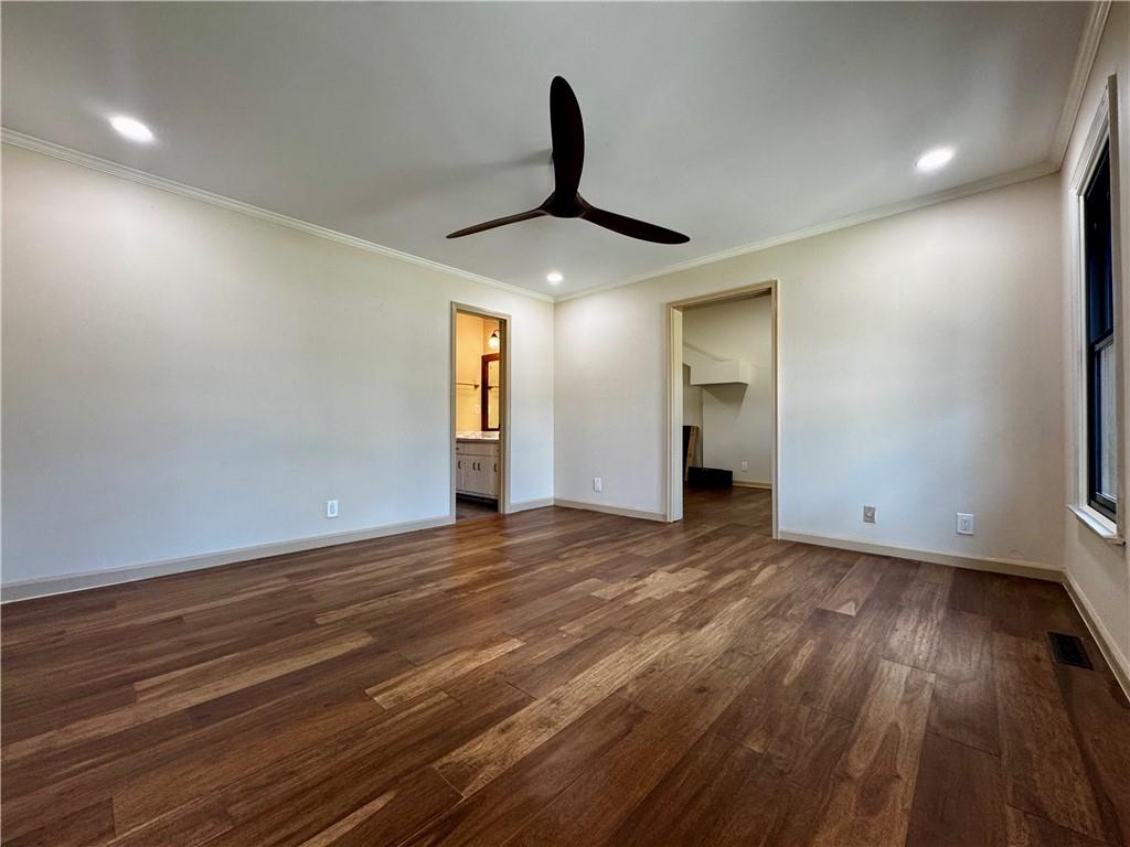 1709 Rangewood Drive Southwest Lilburn, GA 30047 - Photo 27 of 52 a view of empty room with wooden floor and fan
