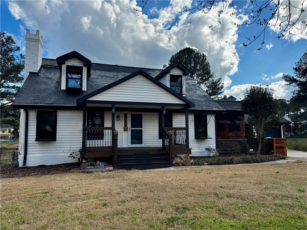 1709 Rangewood Drive Southwest Lilburn, GA 30047 - Photo 3 of 52 a front view of a house