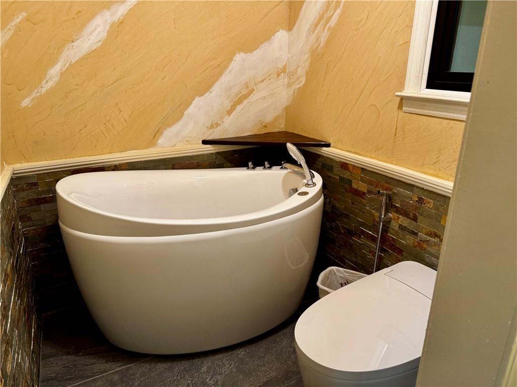 1709 Rangewood Drive Southwest Lilburn, GA 30047 - Photo 34 of 52 a white toilet sitting next to a sink