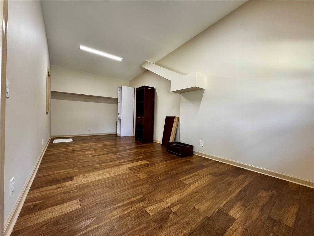 1709 Rangewood Drive Southwest Lilburn, GA 30047 - Photo 35 of 52 a view of an empty room with wooden floor