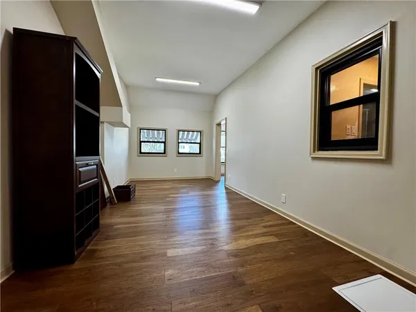 a view of room window and wooden floor