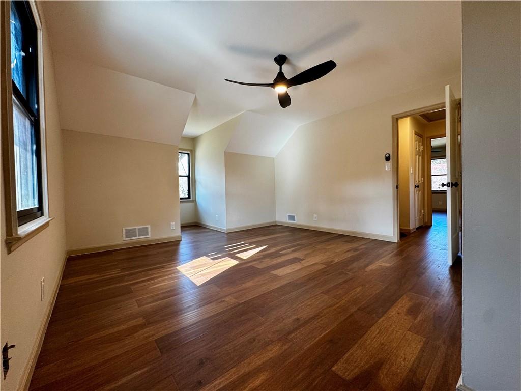 1709 Rangewood Drive Southwest Lilburn, GA 30047 - Photo 40 of 52 a view of empty room with wooden floor and fan