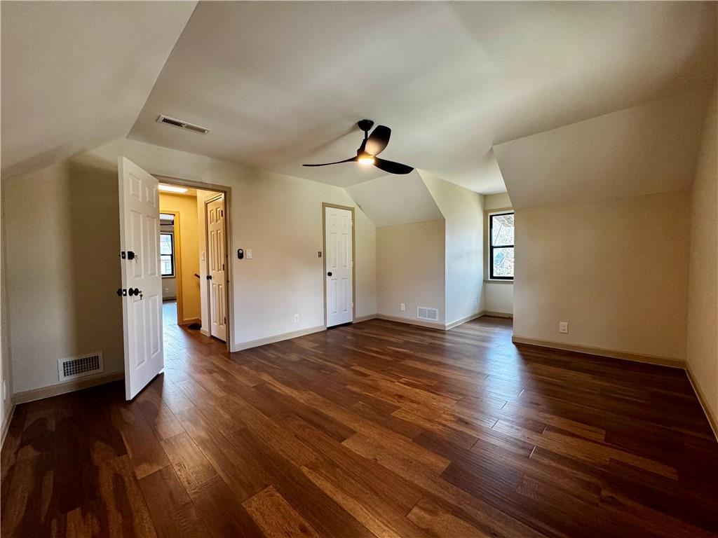 1709 Rangewood Drive Southwest Lilburn, GA 30047 - Photo 45 of 52 a view of empty room with wooden floor