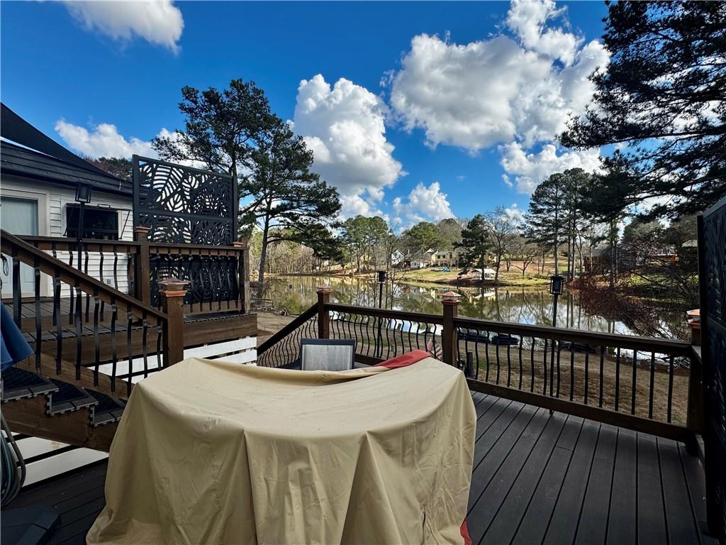 1709 Rangewood Drive Southwest Lilburn, GA 30047 - Photo 46 of 52 a view of a balcony with two chairs and a potted plant