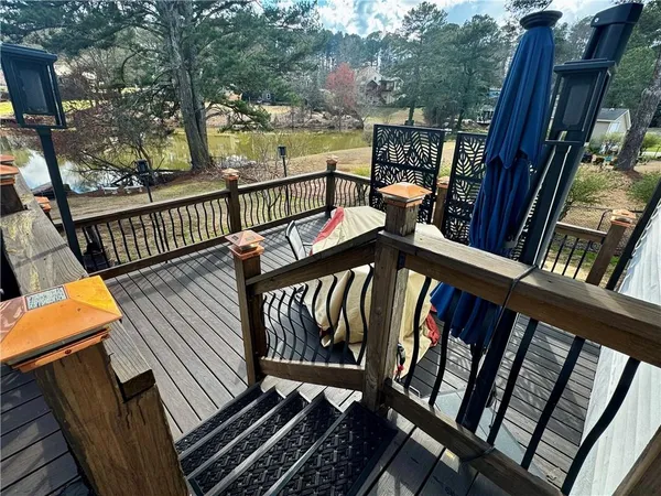 a front view of a house with a yard covered with snow