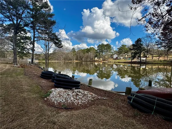 a view of a lake with a bench and lake view