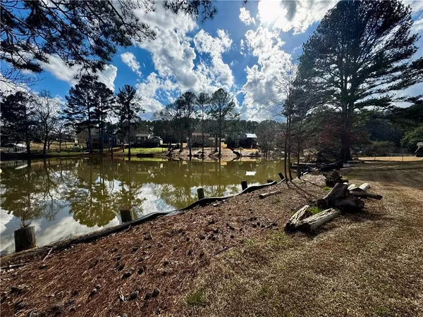 a view of a lake with a yard