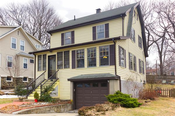 91 Ronald Road Arlington, MA 02474 - Photo 1 of 26 a front view of a house with a yard