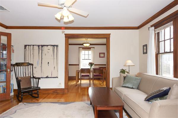 91 Ronald Road Arlington, MA 02474 - Photo 13 of 26 a living room with furniture a window and a chandelier