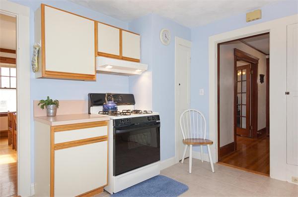 91 Ronald Road Arlington, MA 02474 - Photo 16 of 26 a kitchen with stainless steel appliances granite countertop a stove and a refrigerator
