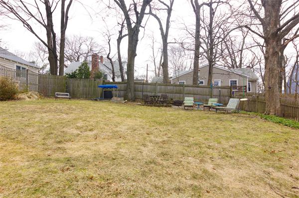 91 Ronald Road Arlington, MA 02474 - Photo 19 of 26 a view of a yard with a house and trees
