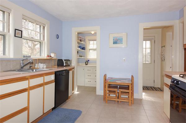91 Ronald Road Arlington, MA 02474 - Photo 5 of 26 a kitchen with a stove a sink and a refrigerator
