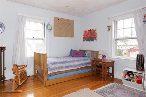 91 Ronald Road Arlington, MA 02474 - Photo 7 of 26 a bedroom with a bed and a window