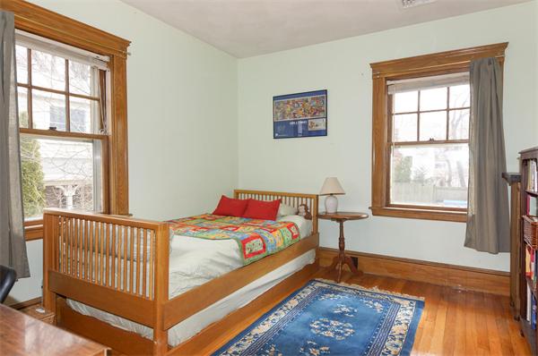 91 Ronald Road Arlington, MA 02474 - Photo 8 of 26 a bedroom with a bed and a window