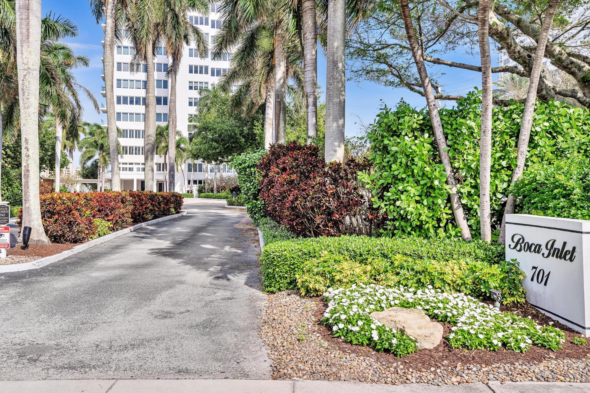 701 East Camino Real, Unit 12G Boca Raton, FL 33432 - Photo 43 of 82 a view of a street with potted plants and large trees