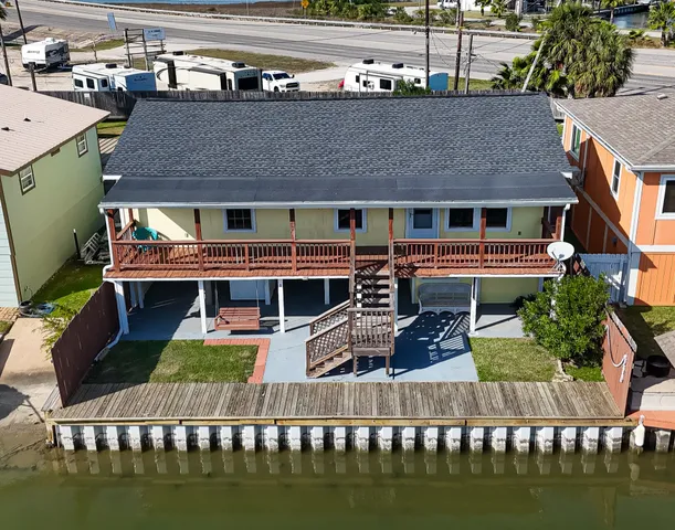 a aerial view of house with yard swimming pool and outdoor seating