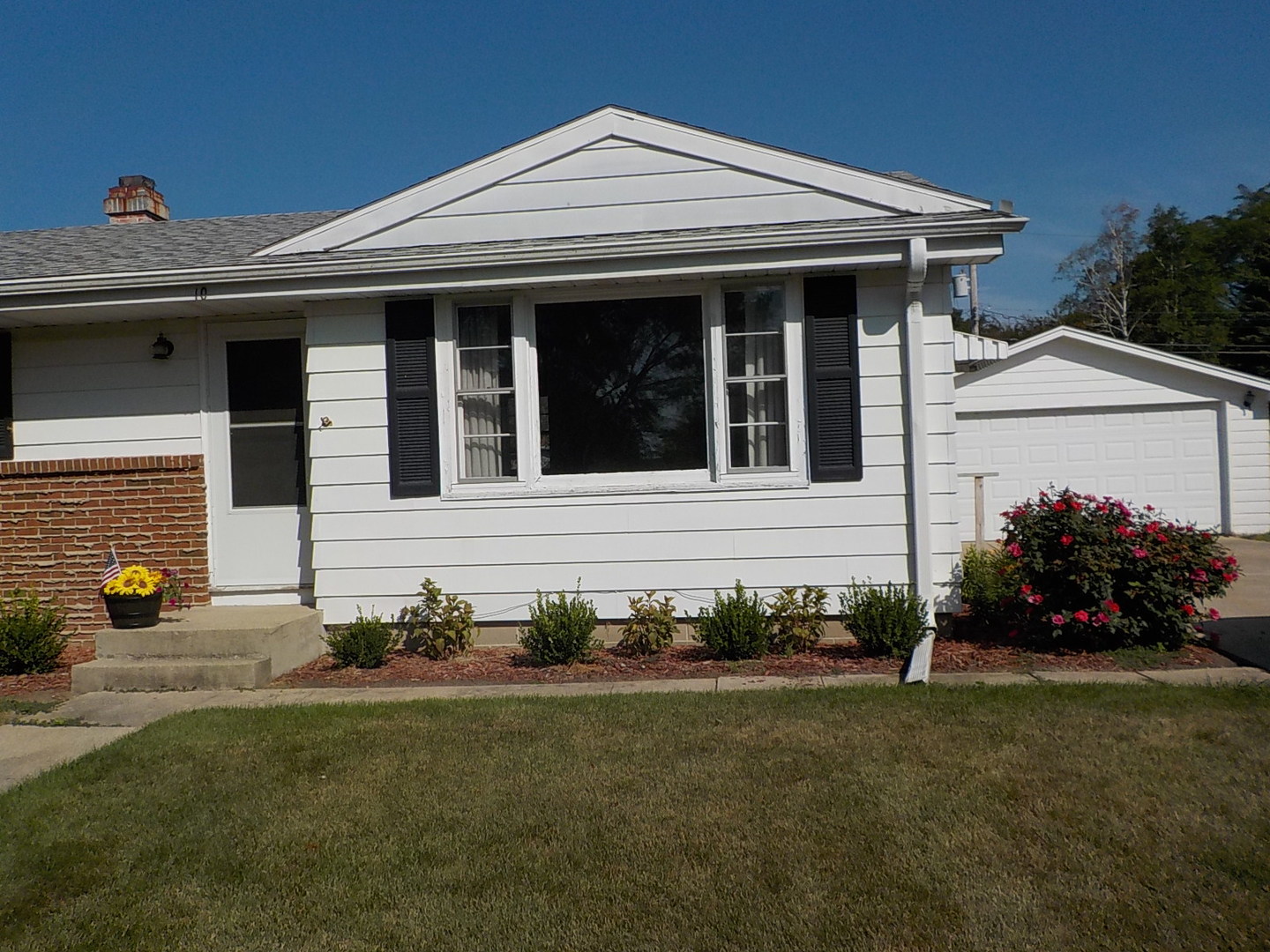104 Janet Avenue Rochelle, IL 61068 - Photo 1 of 14 a view of a house that has a garden
