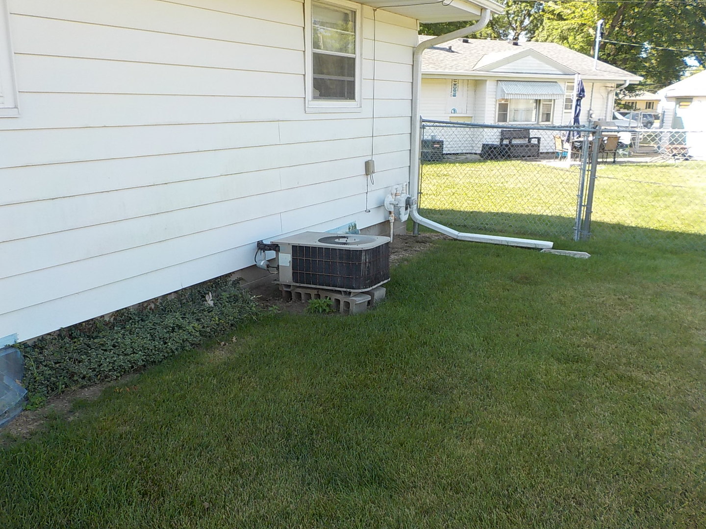 104 Janet Avenue Rochelle, IL 61068 - Photo 4 of 14 a view of a house with a backyard and a swimming pool